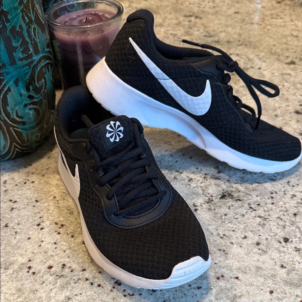 Nike Women's Black and White Athletic Sneakers like new. Only used in cheer gym.
